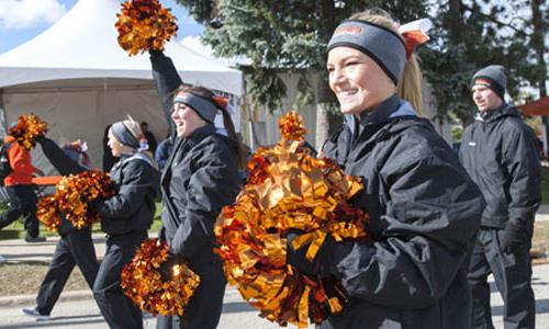 members of the cheerleading team with pompoms